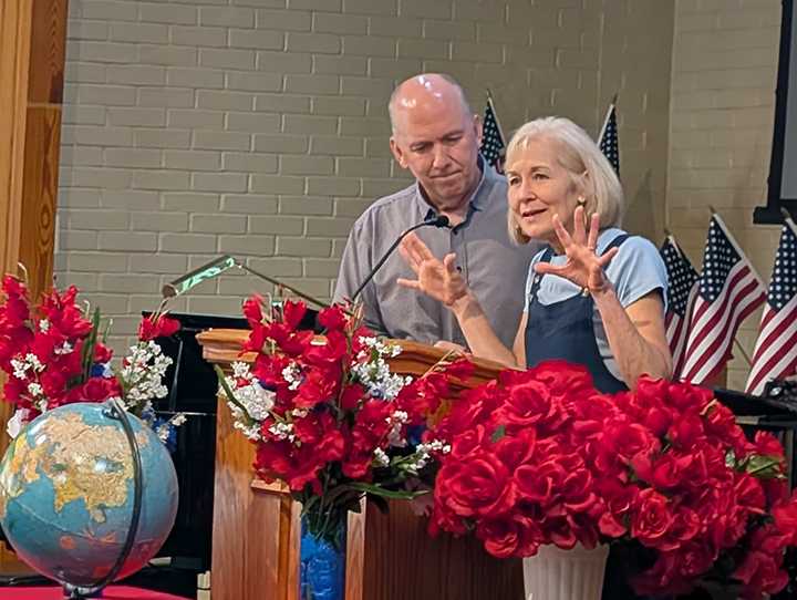 Jonathan and Mary Sheaffer speaking at the podium