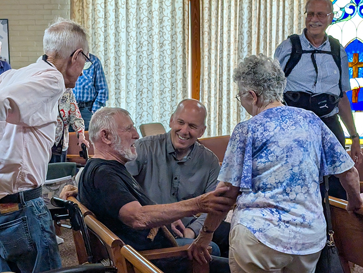 The Alliance President talking to residents