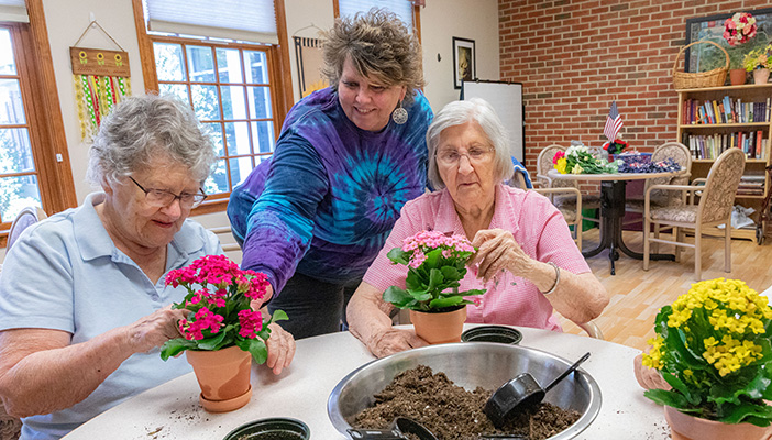 women planting flower pots