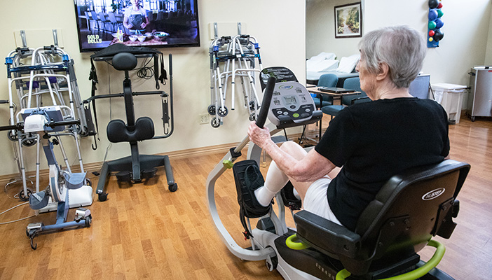 woman on fitness machine